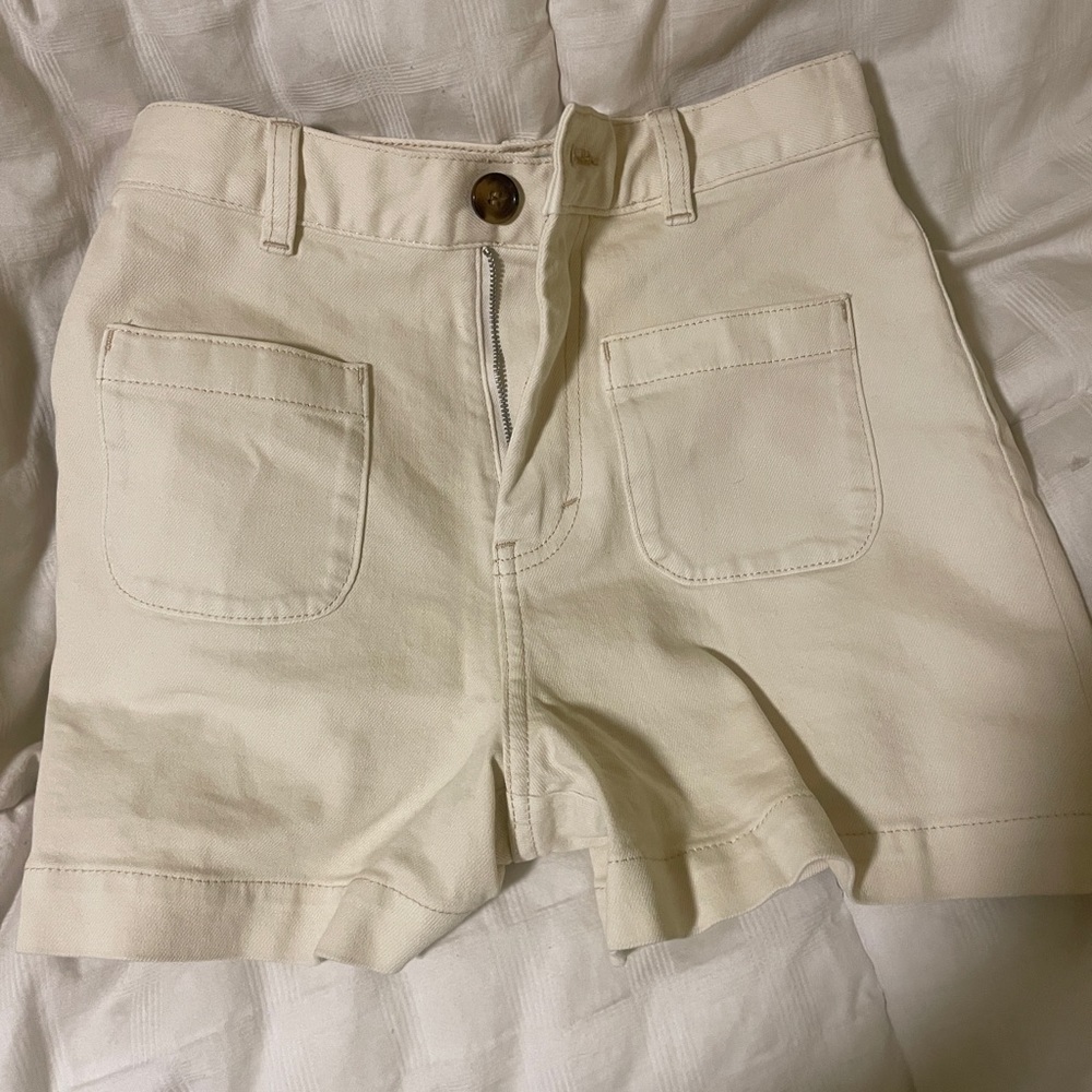 & Other Stories white high-waisted shorts.